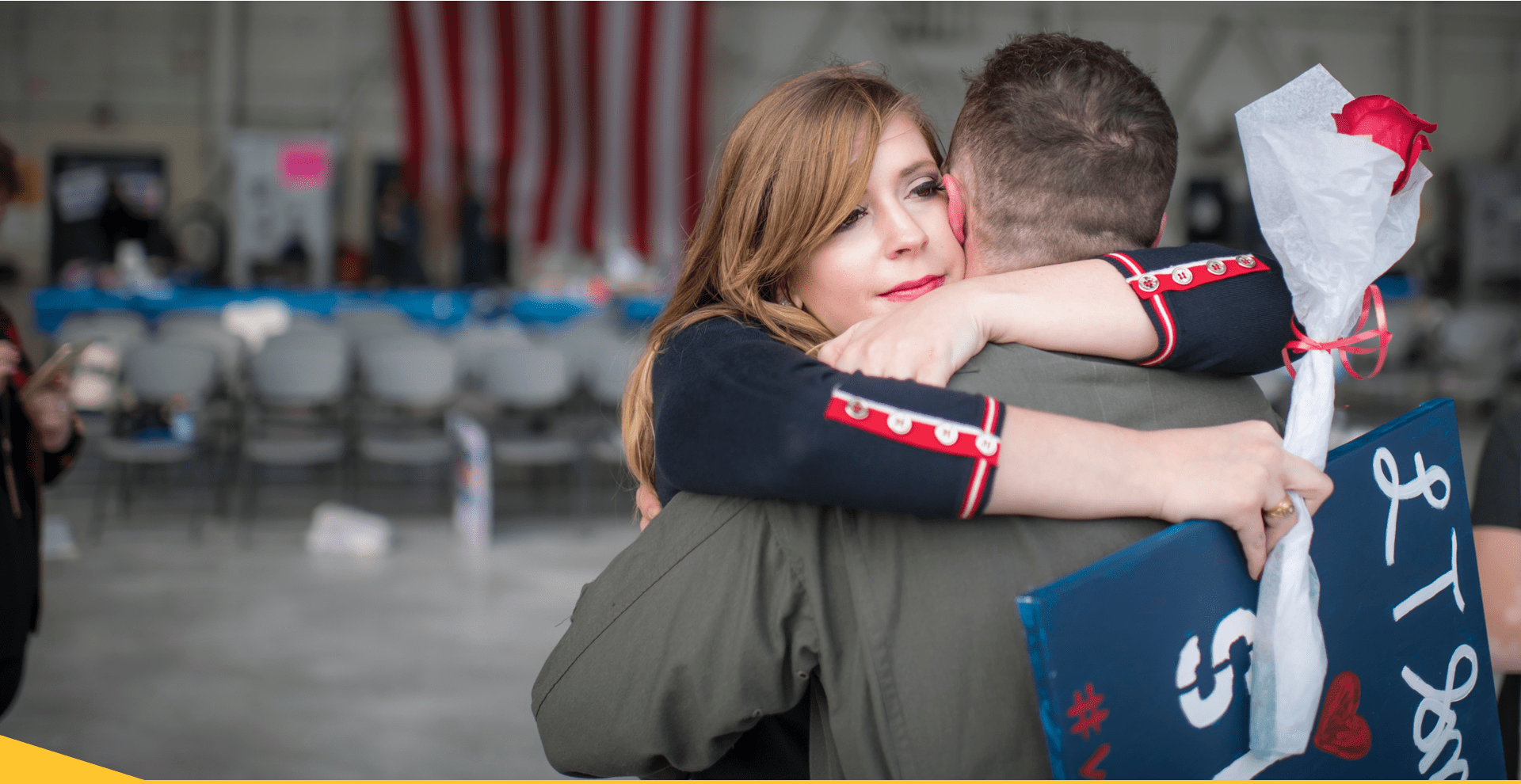 Military member and spouse embracing