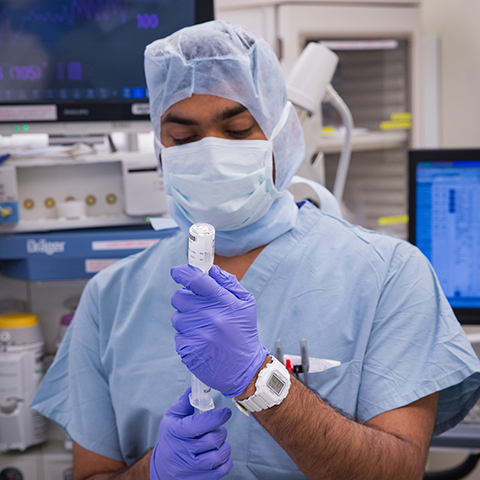 Image of anesthesiologist administering medication