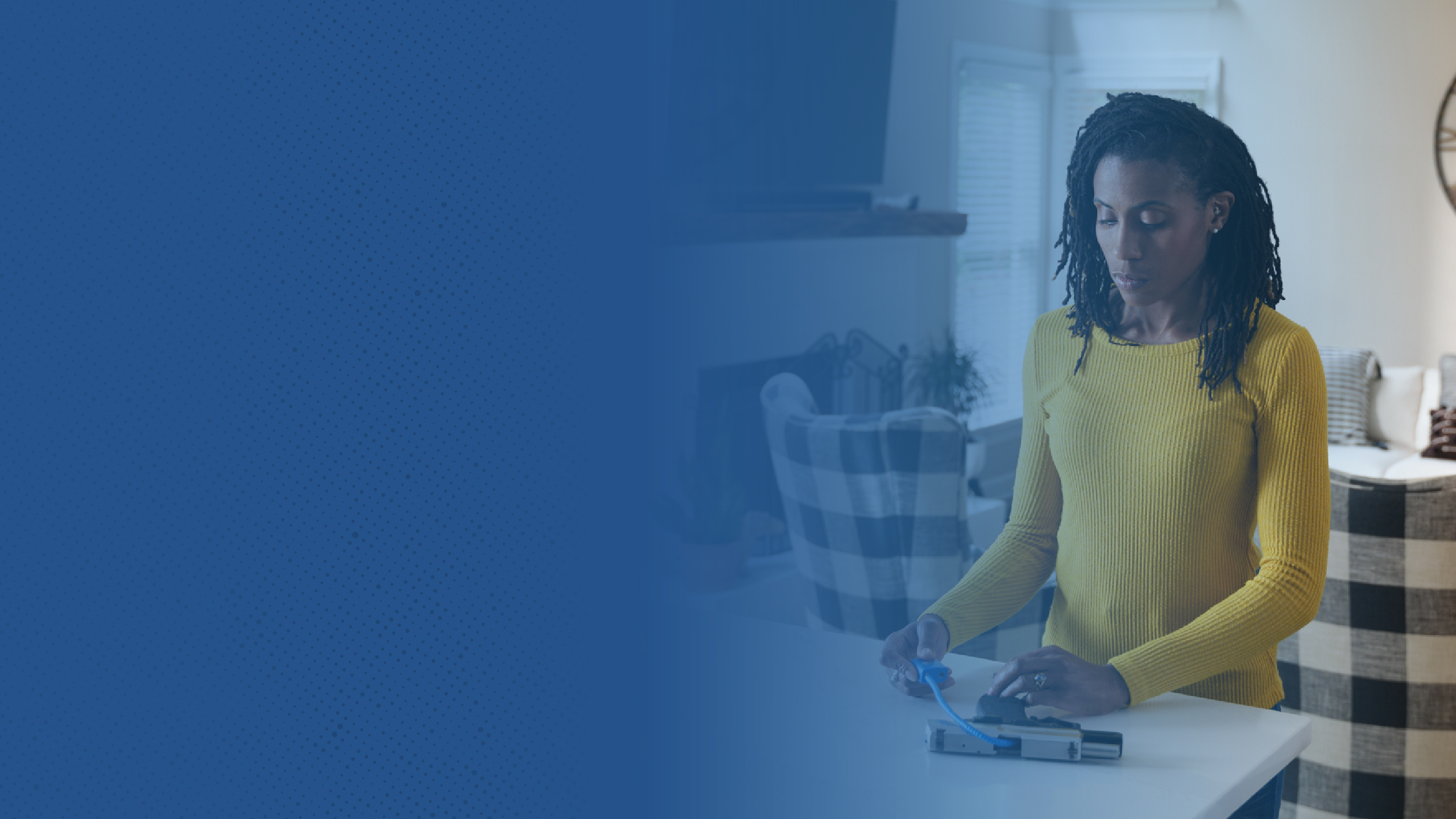 An image of a woman securing a firearm with a gun lock on a kitchen counter.